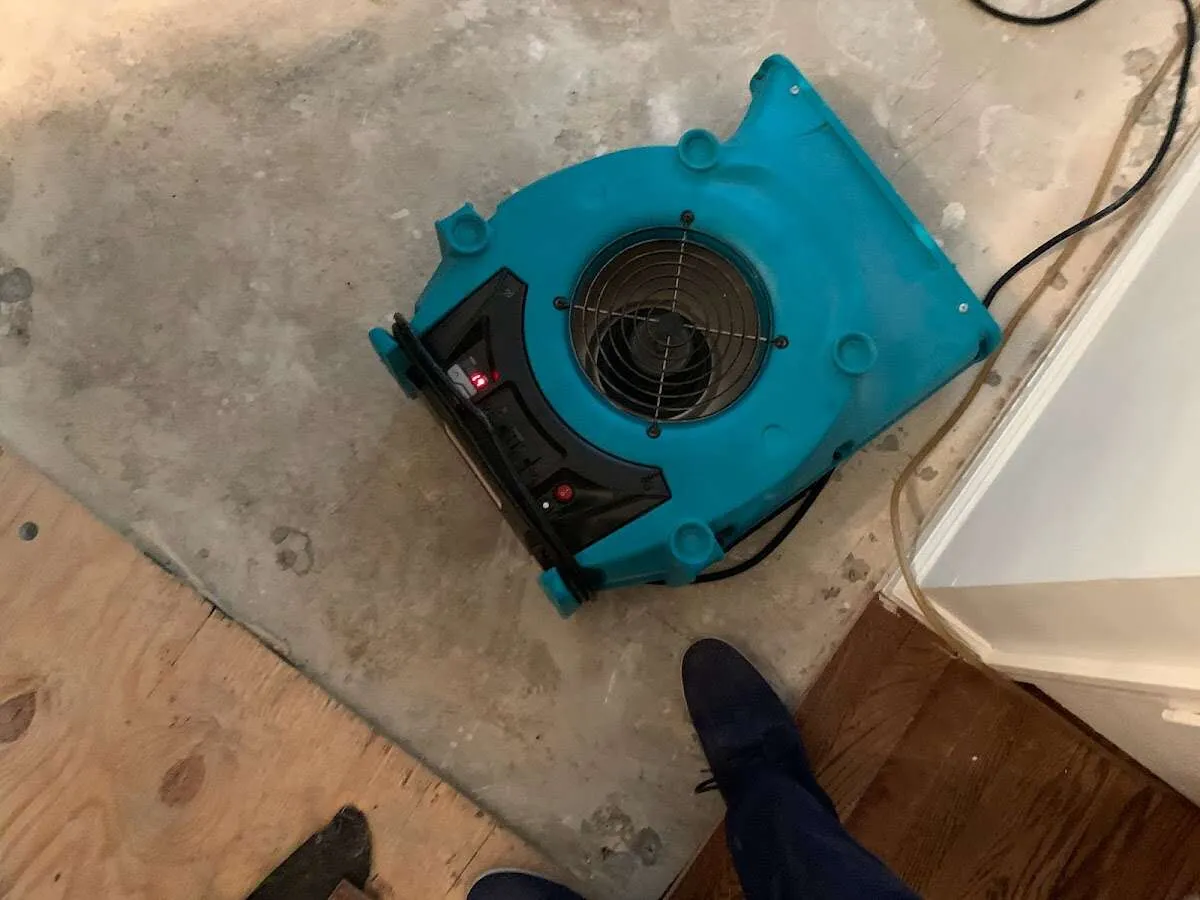 Air mover drying subfloor during Leak Detection & Repair in Winnetka